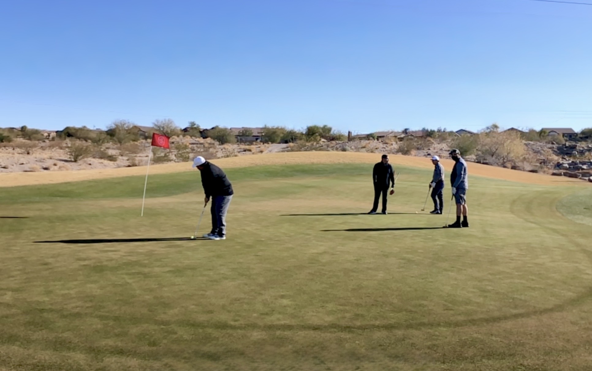 Desert Dawgs together on the putting green during the inaugural trip